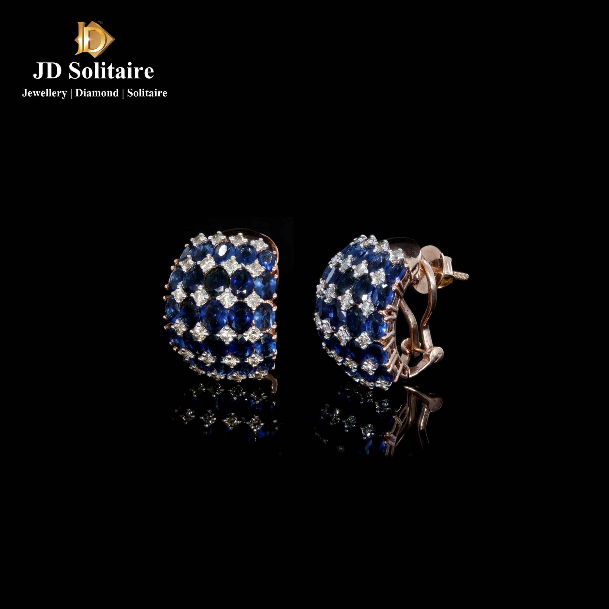 Stud earrings in 9ct gold set with a synthetic blue sapphire coloured stone  | Laval Europe